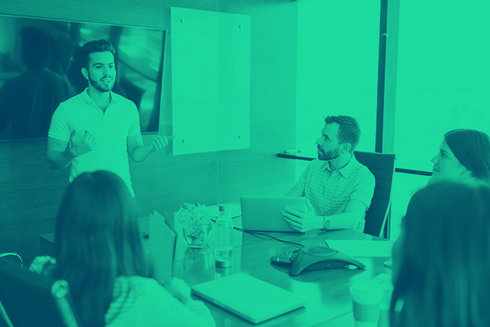 Man giving presentation to people in a conference room