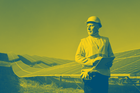 Man next to solar panels